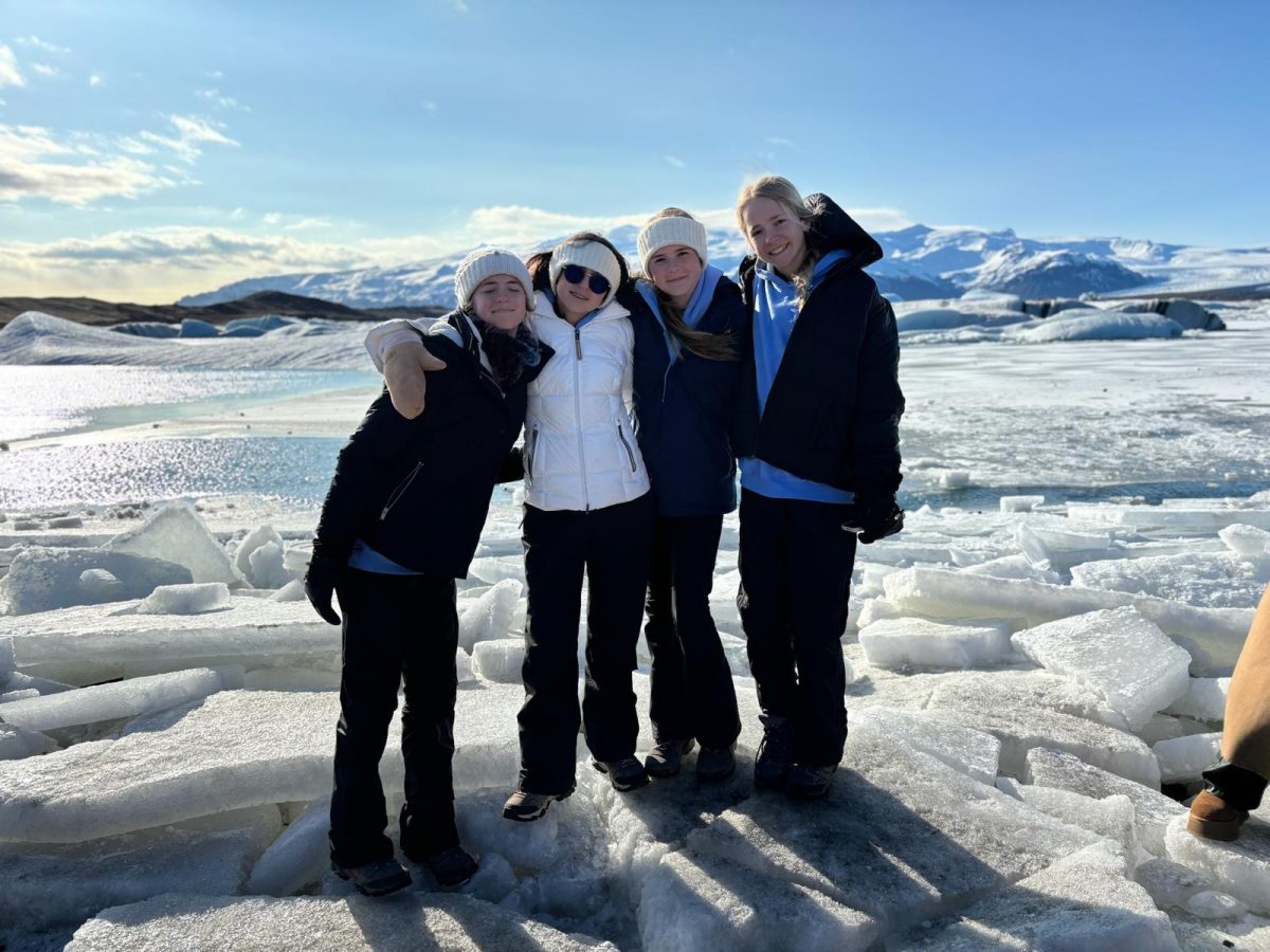 Students pose in front of glaciers after a hike to see this view. “This view was so beautiful and I am so happy I was able to see this,” said 7th grader Emma Salar.
